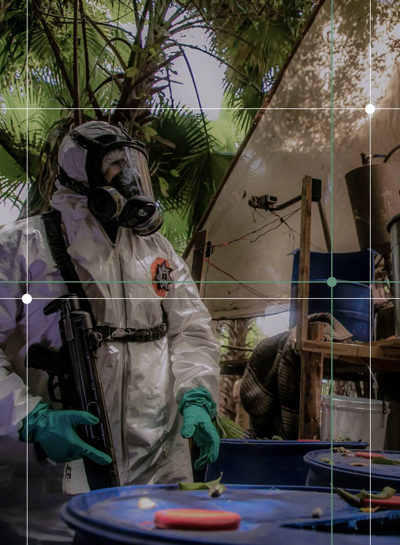 A Sinaloa's state police officer works during the dismantle of one of the three clandestine laboratories producers of synthetic drug, mainly methamphetamine in El Dorado, Sinaloa state